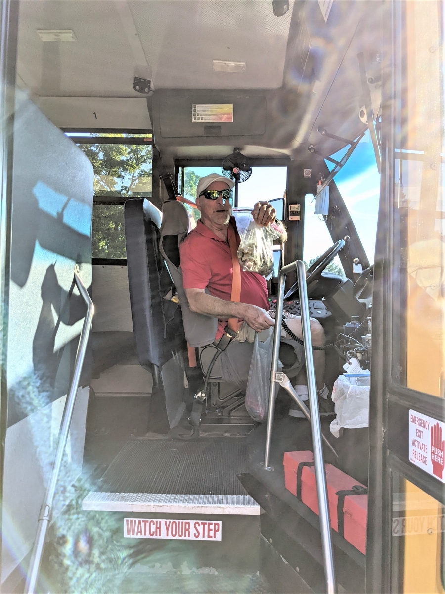 bus driver with bag of dog bones